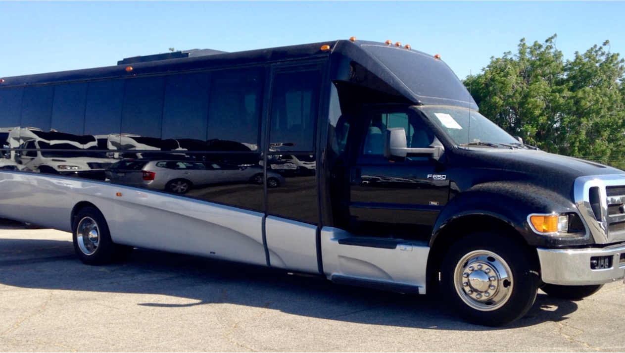 Our black VIP Midsize motorcoach with seating for 31 passengers.